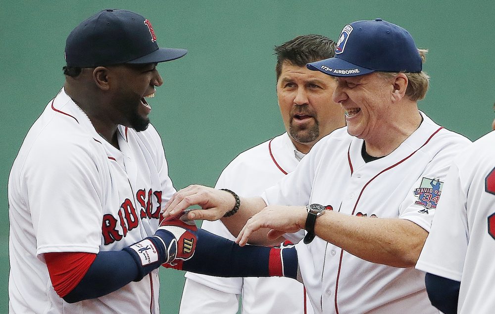 Boston Red Sox's David Ortiz, left, jokes with former teammates Curt Schilling, right, and Jason Varitek during a ceremony before a baseball game against the Toronto Blue Jays in Boston on Sunday. (Michael Dwyer/AP)