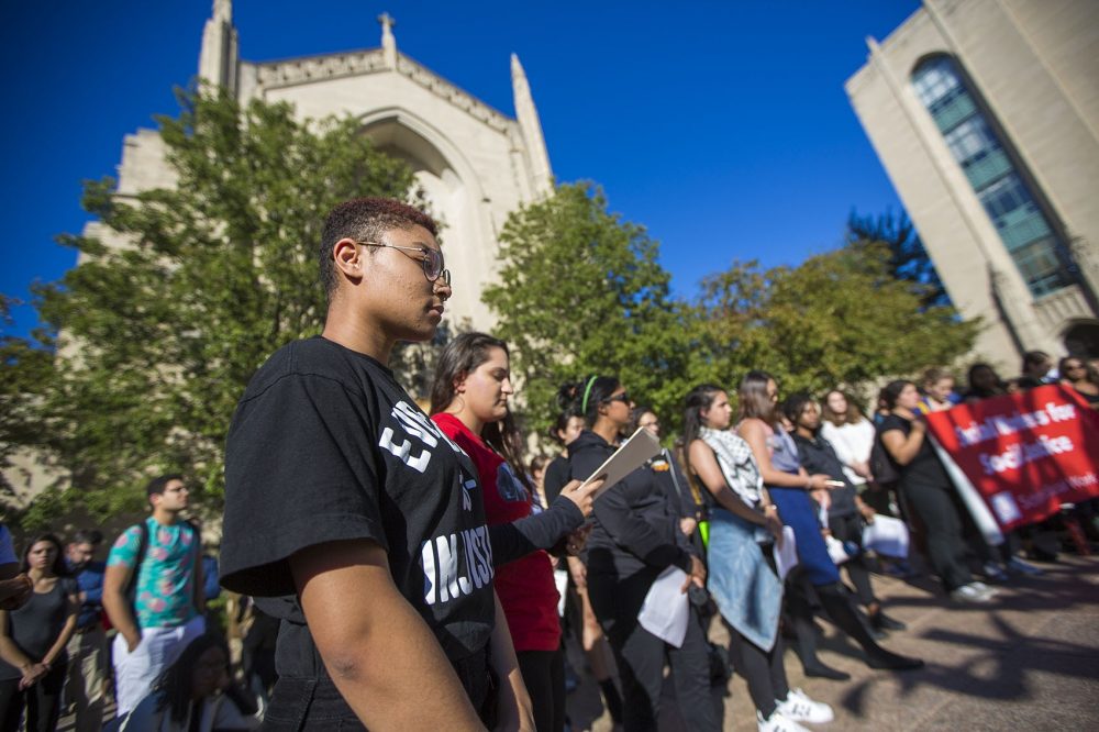 Students pause for a moment of silence during a Black Lives Matter protest. (Jesse Costa/WBUR)
