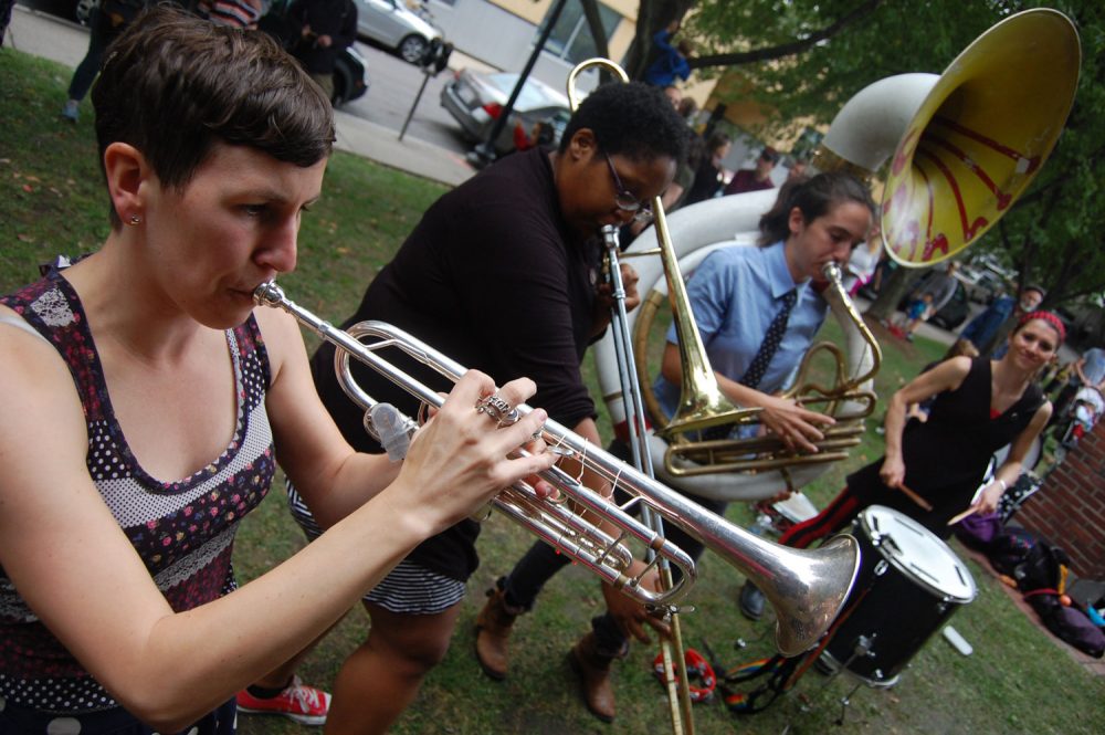 Boycott, the &quot;no-boys-all-badass brass band&quot; from Somerville, performs at the Honk Festival in Somerville's Seven Hills Park on Saturday. (Greg Cook for WBUR)