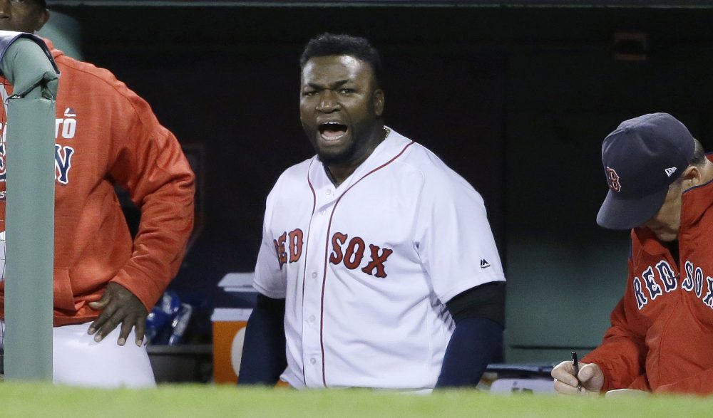 Ortiz encourages the crowd from the dugout during the eighth inning. (Elise Amendola/AP)