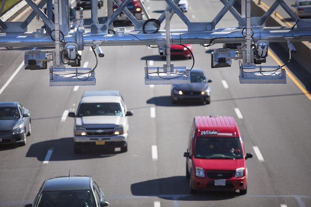 The state's move to all-electronic tolling means drivers without an E-ZPass transponder will pay more. Drivers who don't have an E-ZPass will have a six-month &quot;grace period,&quot; in which they can apply for one and get credited the difference between their bill and the lower E-ZPass rate. (Jesse Costa/WBUR)