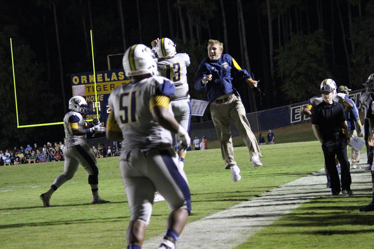 At 26 years old, Scotty Walden is America's youngest college football coach. "I’m young. I’m the same age as those guys in the room. There’s actually several players in the room that are older than me," Walden says. "One of our stud receivers that I threw the ball to the year before was 26 years old. I was 22. How’s he gonna listen to me?" (Courtesy Adam Ledyard)