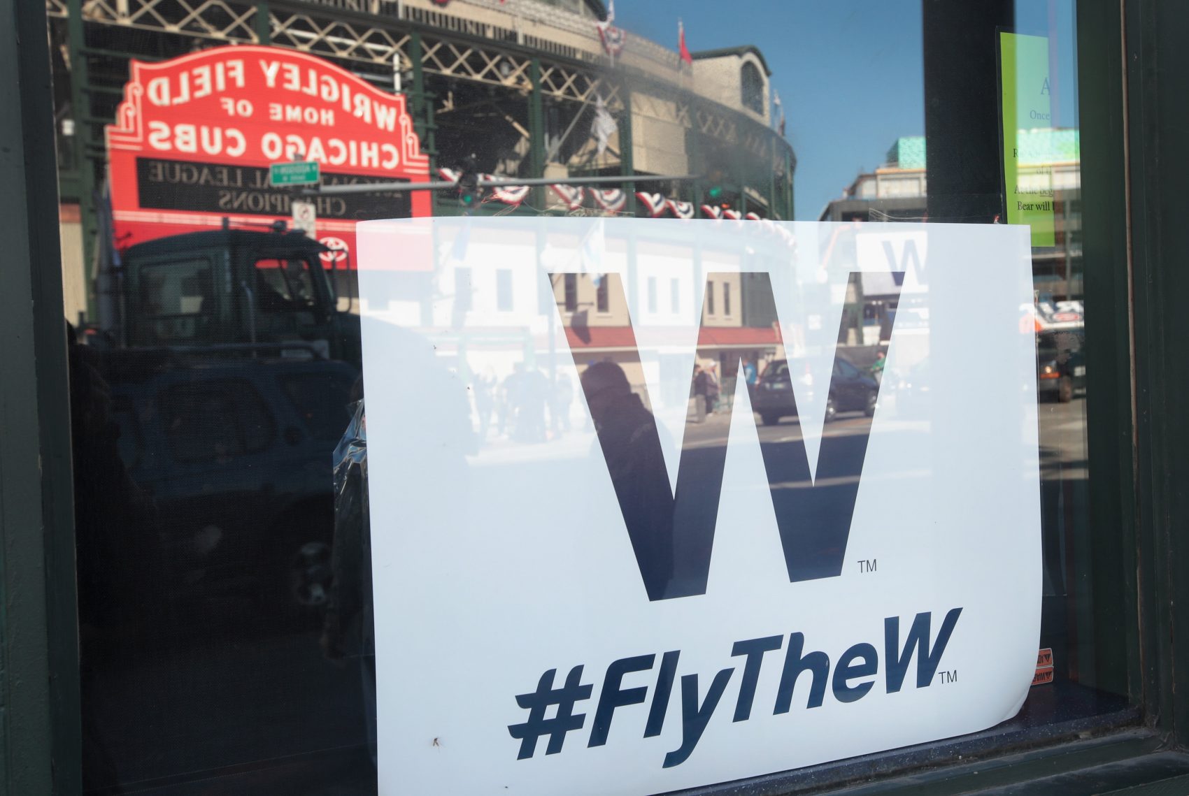 A "W" flag hangs in the window of a bar across from Wrigley Field, the home of the Chicago Cubs, on Oct. 24, 2016 in Chicago. (Scott Olson/Getty Images)
