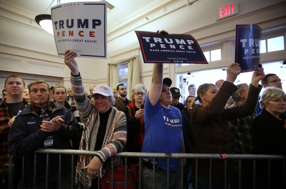 Supporters of Donald Trump and Mike Pence display placards during a campaign stop for Republican vice presidential candidate, Indiana Gov. Mike Pence in Rochester, N.H. on Sunday. (Steven Senne/AP)