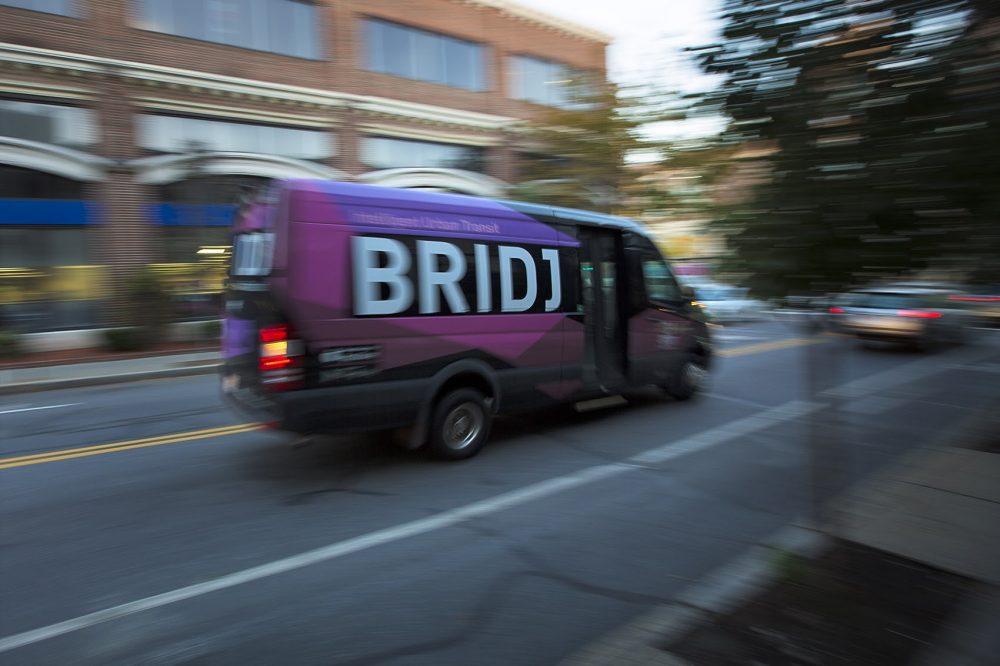A Bridj bus travelling down St. Paul St. in Brookline. (Jesse Costa/WBUR)