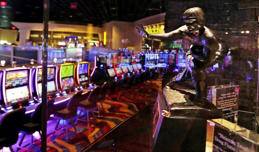 The Heisman Trophy, won in 1984 by Boston College quarterback Doug Flutie, is displayed at the Plainridge Park Casino in Plainville. (Charles Krupa/AP)