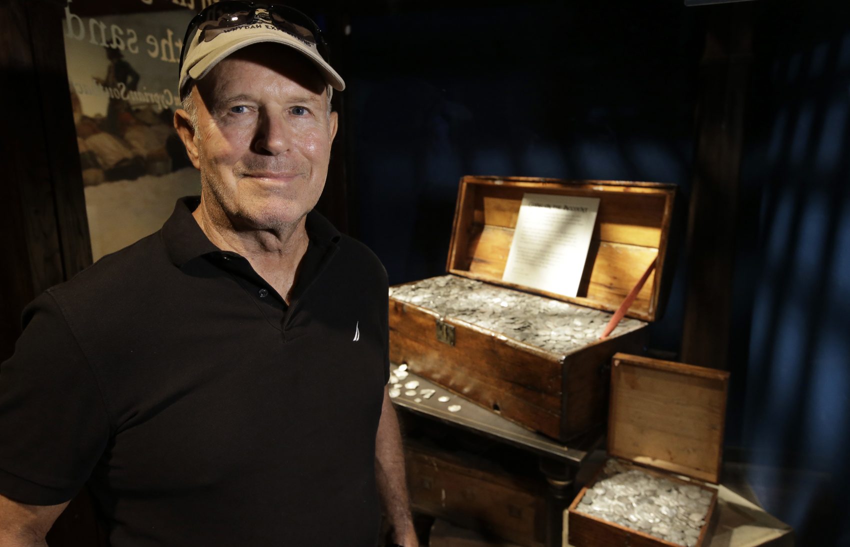 Undersea explorer Barry Clifford stands next to a display case containing silver coins recovered from the wreckage of the pirate ship Whydah Gally, at the Whydah Pirate Museum, in Yarmouth. Clifford, who discovered the Whydah Gally, the first authenticated pirate shipwreck in U.S. waters, says he’s finally found where the ship’s vaunted treasure lies after more than 30 years of poking around the murky waters off Cape Cod. (Steven Senne/AP)