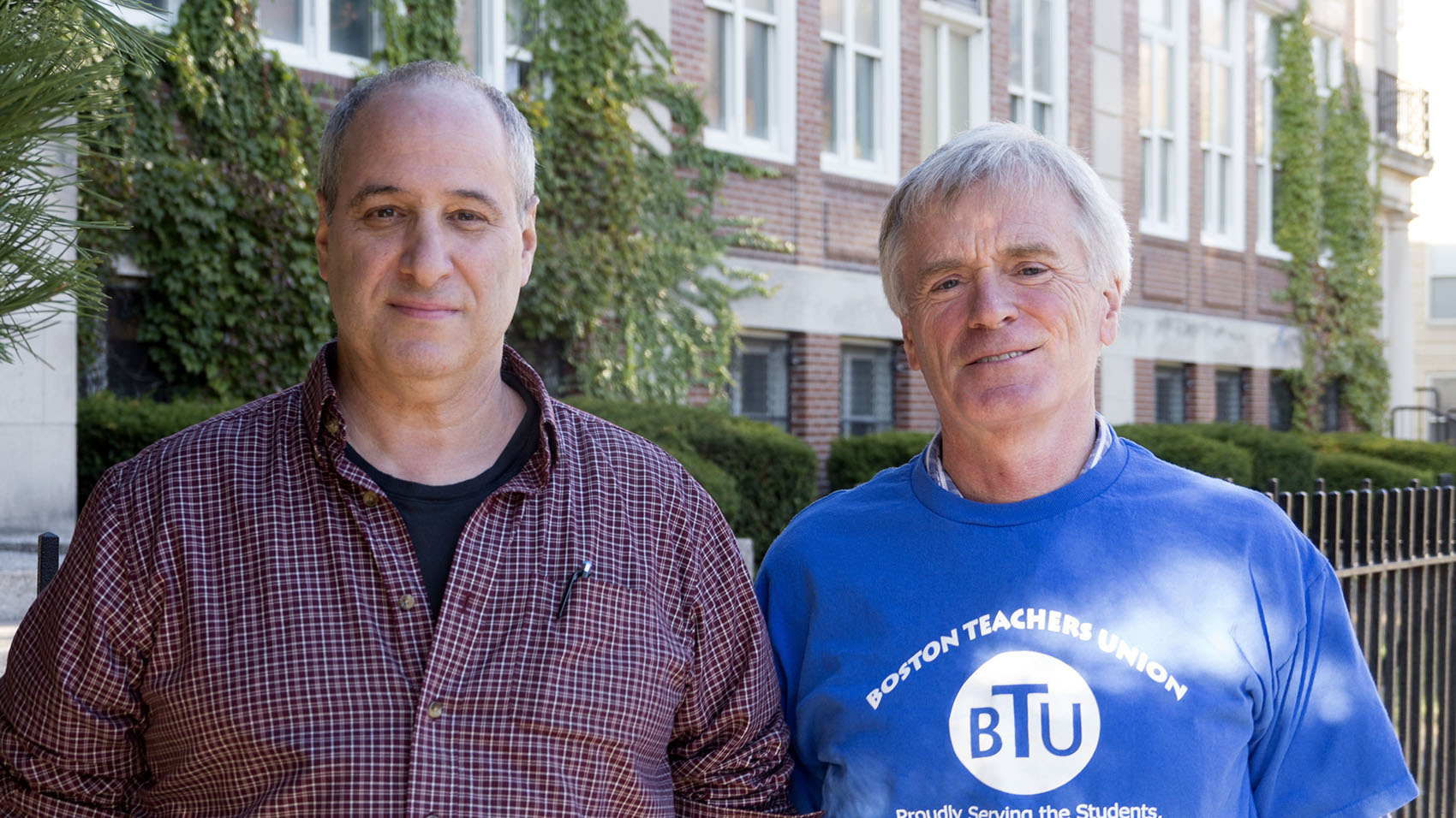 Warren Pemsler and David Russell have taught for decades at the McKinley schools' South End campus. (Max Larkin/WBUR)