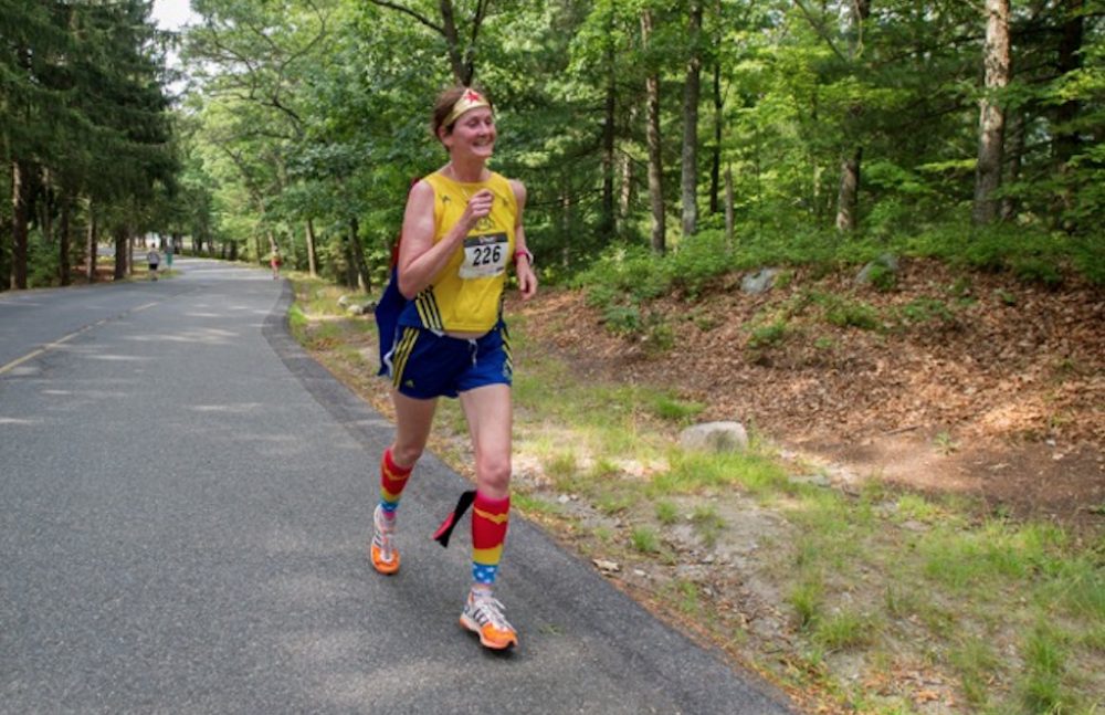 Carol Chaoui runs a race in Brockton in July. &quot;Since I can no longer run fast,&quot; she says, &quot;I am usually in a Wonder Woman costume!&quot; (Courtesy of the author)