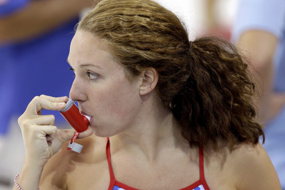 In this July 26, 2012 file photo, U.S. swimmer Shannon Vreeland uses an inhaler during a practice session at the Aquatics Center at Olympic Park ahead of the 2012 Summer Olympics, in London. (Lee Jin-man/AP)