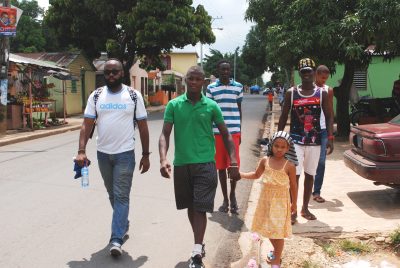 Adonis, his 5-year-old niece Alba, and his entourage parade through town on his way to spar. (Ken Shulman)