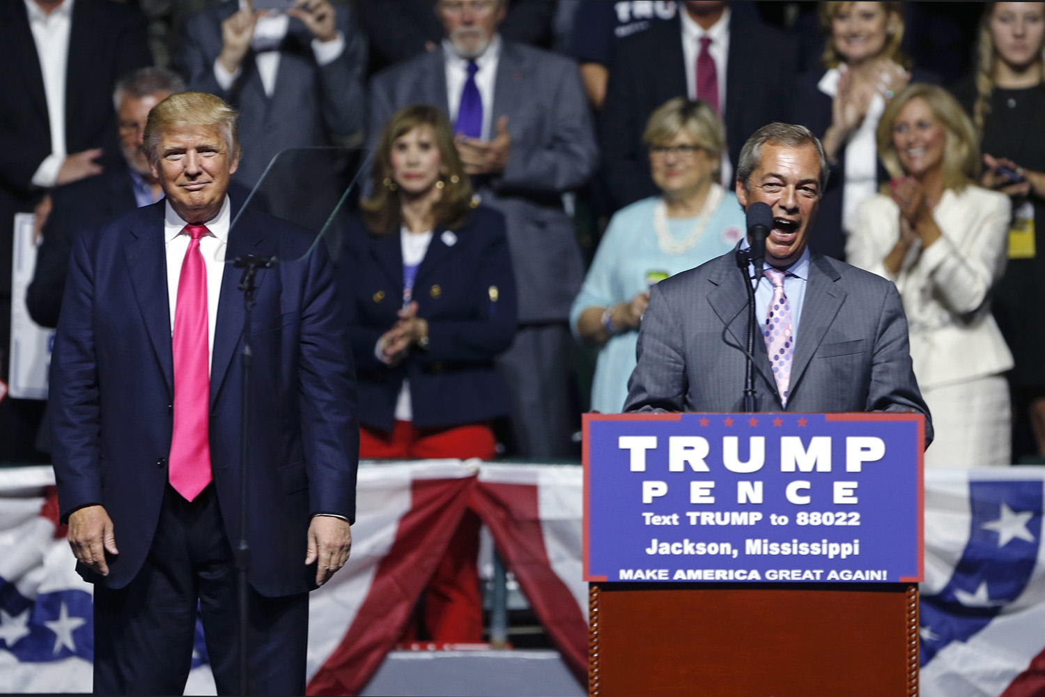 Nigel Farage, ex-leader of the British UKIP party, speaks as Republican presidential candidate Donald Trump, left, listens, at Trump's campaign rally in Jackson, Miss. (Gerald Herbert/AP)