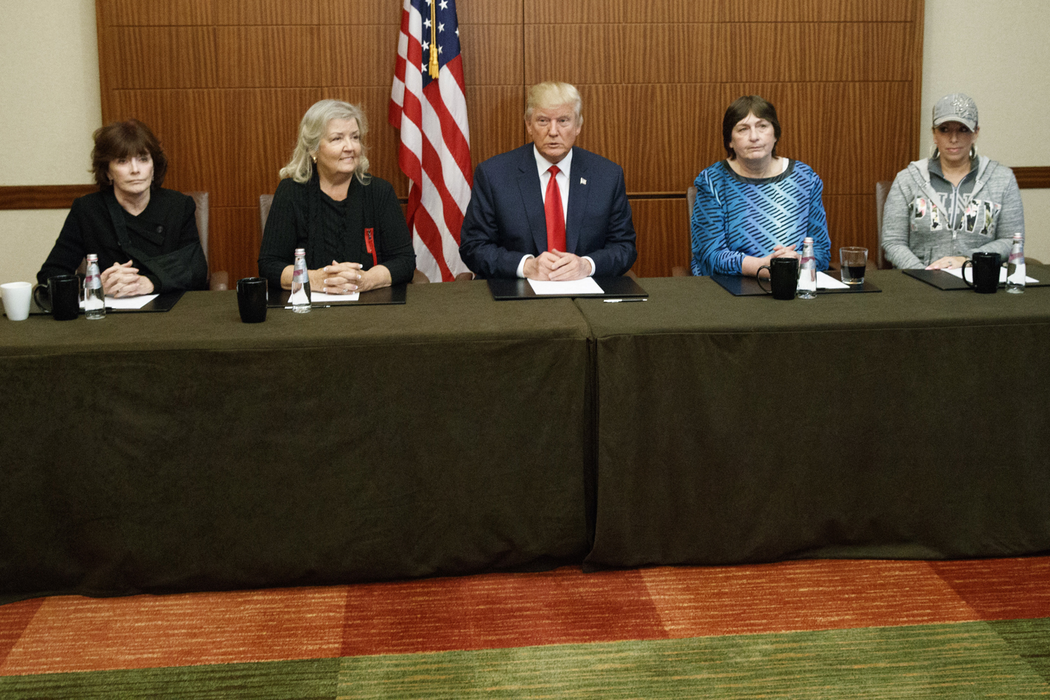 Republican presidential candidate Donald Trump, center, sits with, from right, Paula Jones, Kathy Shelton, Juanita Broaddrick, and Kathleen Willey, before the second presidential debate with democratic presidential candidate Hillary Clinton at Washington University. (Evan Vucci/AP)