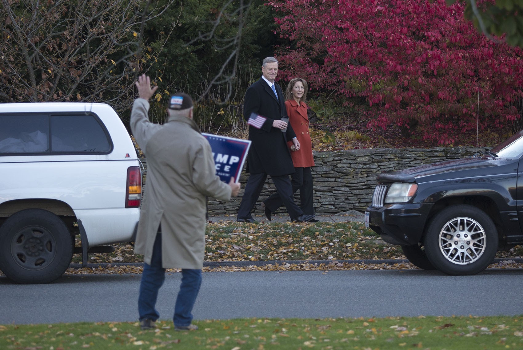 Charlie and Lauren Baker walk to the polls in Swampscott on Tuesday morning. (Jesse Costa/WBUR)