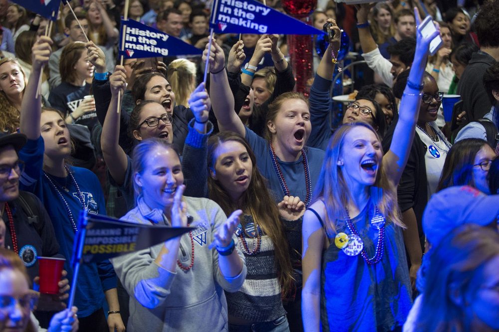 Supporters cheer at Wellesley College as it's announced that Hillary Clinton takes New York Tuesday night. (Jesse Costa/WBUR)
