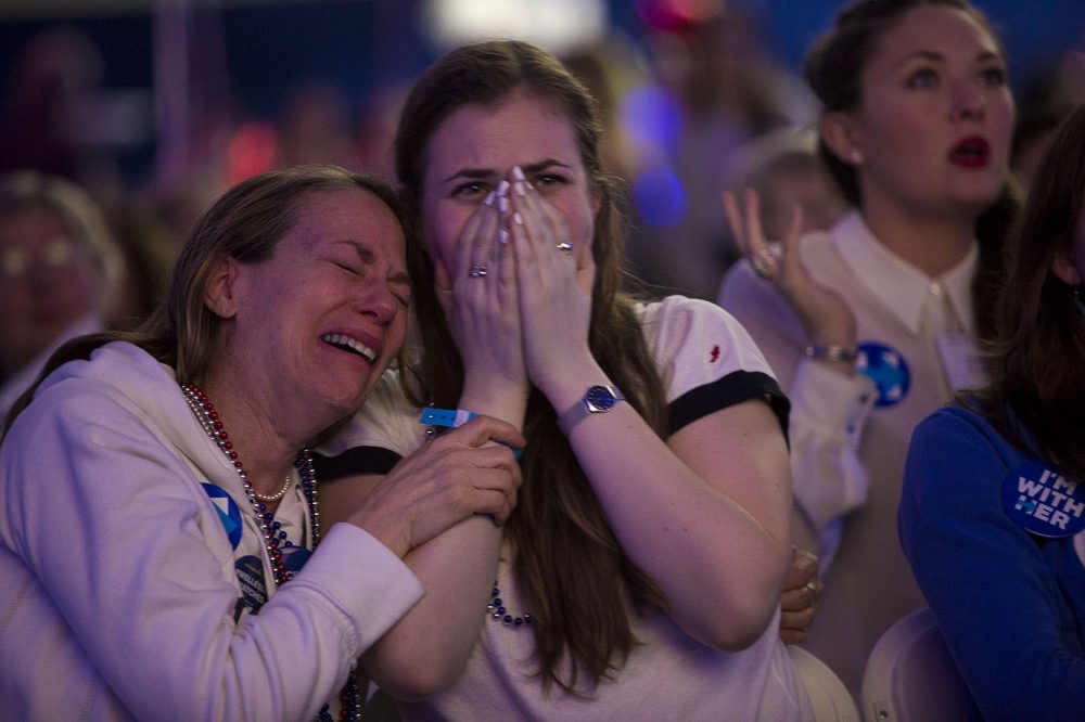 Wendy Salzm (Wellesley Class of 1983) and her daughter Moira Johnston cry as Trump takes the lead in Pennsylvania. (Jesse Costa/WBUR)