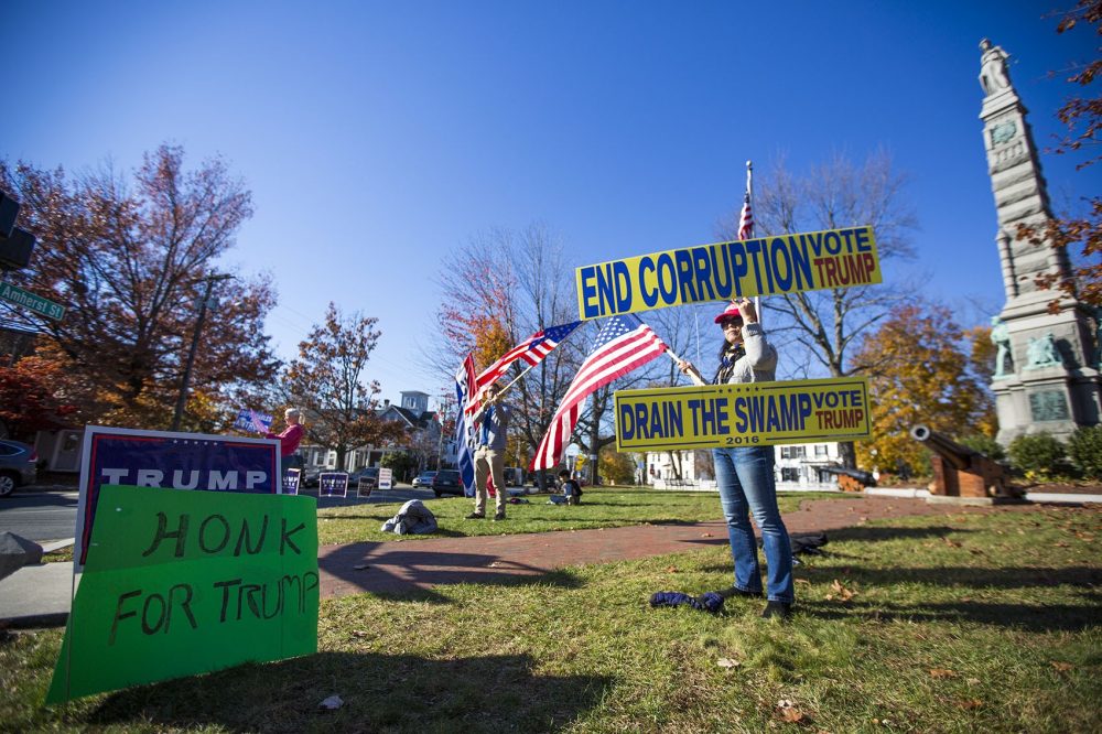 Trump supporters in Nashua, N.H. wave flags and banners. (Jesse Costa/WBUR)