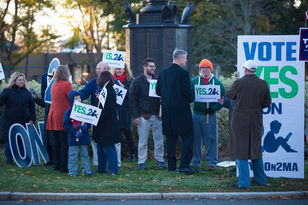 Gov. Baker greets supporters of lifting the cap on charter schools on Monument Avenue in Swampscott. (Jesse Costa/WBUR)