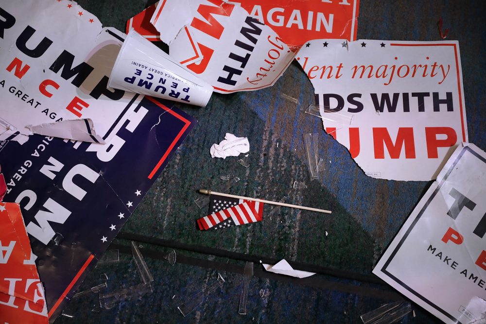 Campaign signs for Republican presidential nominee Donald Trump litter the floor of the room where he celebrated his victory at the New York Hilton Midtown in the early morning hours on Nov. 9, 2016 in New York. (Chip Somodevilla/Getty Images)