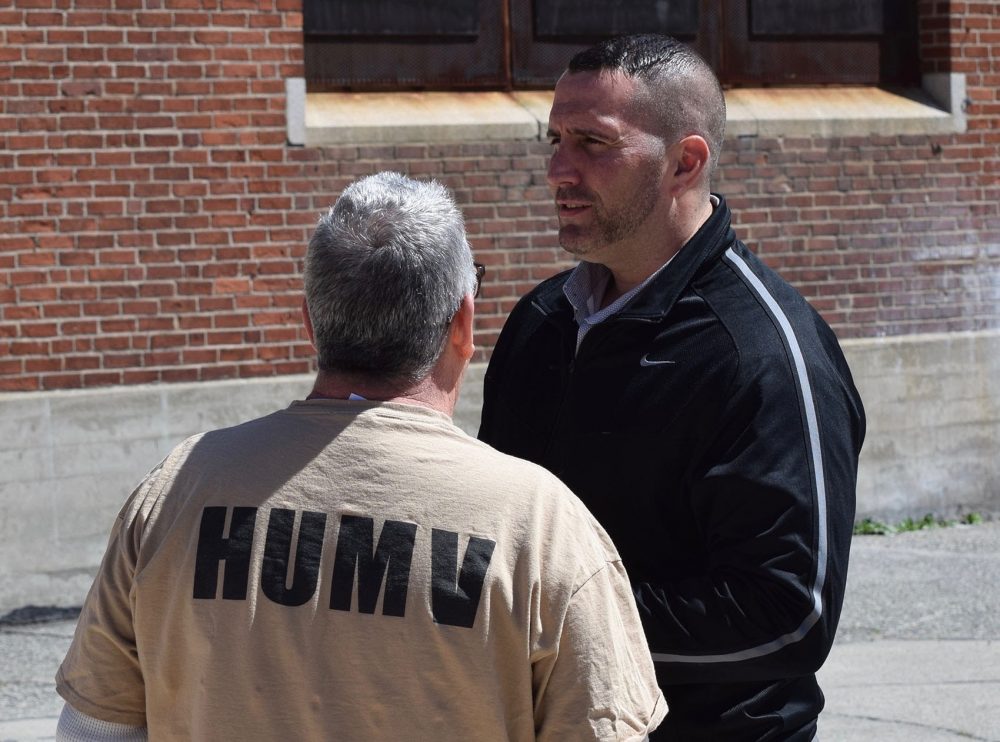 Veterans Services Coordinator Paul Connor speaking with an inmate at Middlesex Jail &amp; House of Correction. (Steve Brown/ WBUR)