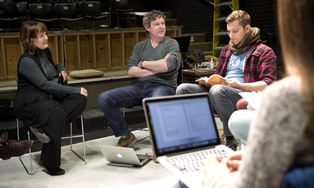 Professor Kate Snodgrass and playwright Ronan Noone lead a class at the Boston Playwrights' Theatre. (Robin Lubbock/WBUR)