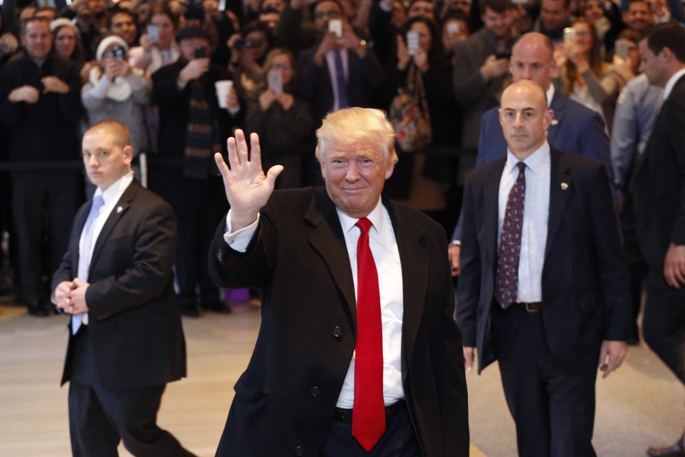 President-elect Donald Trump waves to the crowd as he leaves the New York Times building following a meeting, Tuesday, Nov. 22, 2016, in New York. (Mark Lennihan/AP)