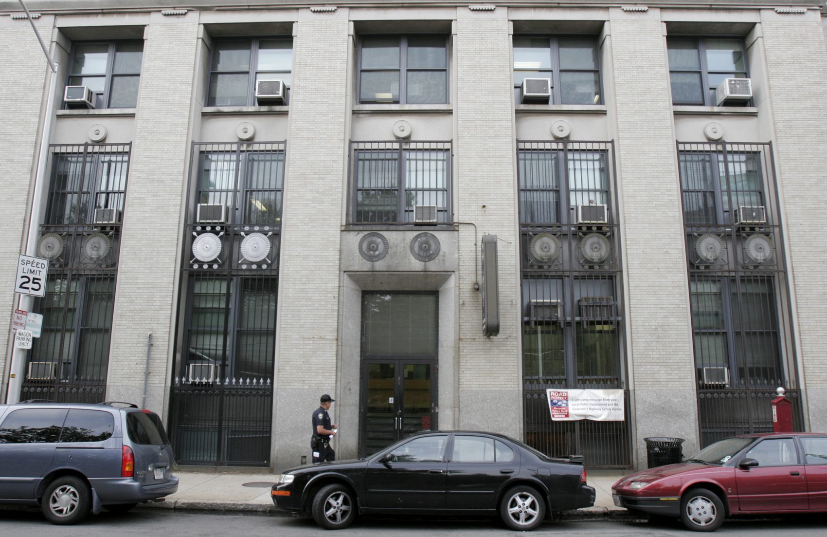 A police officer walks outside the Cambridge Police building. (Kevin Martin/AP)