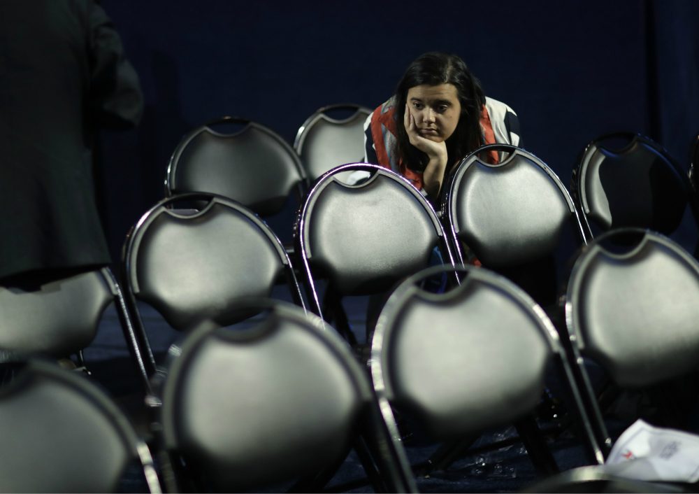 Emily Benn stays in a seat at the end of Democratic presidential nominee Hillary Clinton's election night rally at the Jacob Javits Center in New York, Wednesday, Nov. 9, 2016. (David Goldman/AP)