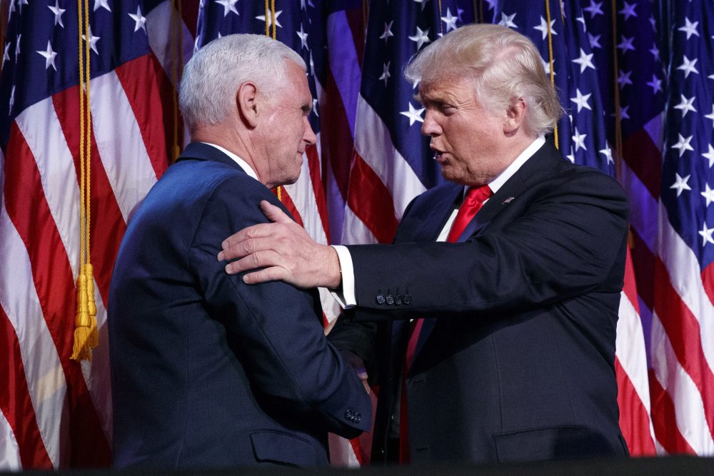 President-elect Donald Trump shakes hands with vice president-elect Mike Pence during their victory rally in New York early Wednesday morning. (Evan Vucci/AP)