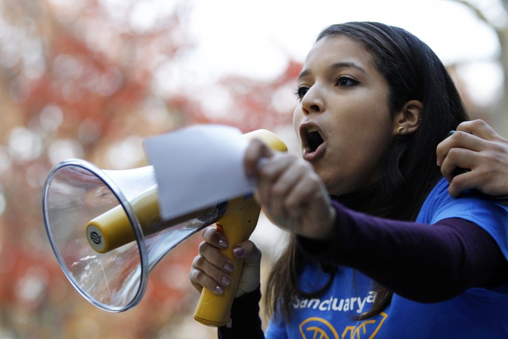Rutgers University junior Carimer Andujar shouts to a large crowd gathered to protest some of President elect Donald Trump policies and to ask school officials to denounce his plans at Rutgers University Wednesday, Nov. 15, 2016, in New Brunswick, N.J. (Mel Evans/AP)