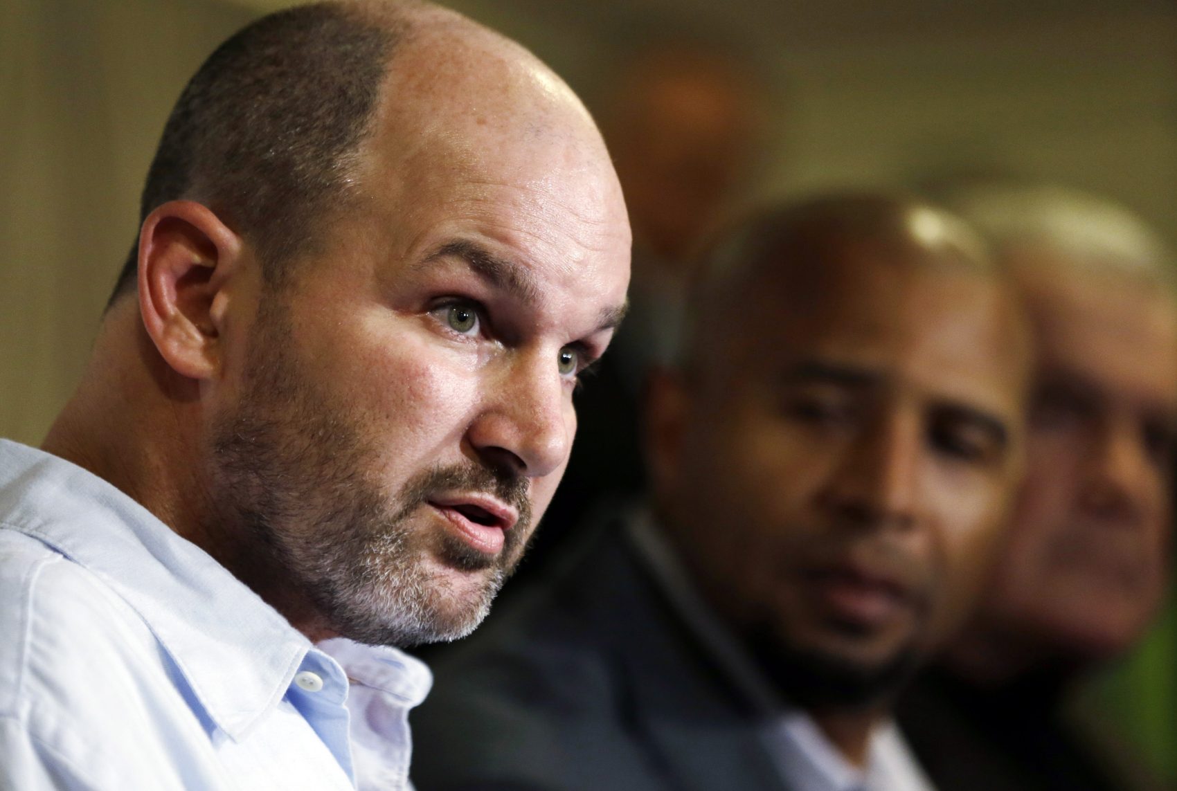 Former NFL player Kevin Turner, left, is seen in this 2013 file photo. Turner died earlier this year. (Matt Rourke/AP)