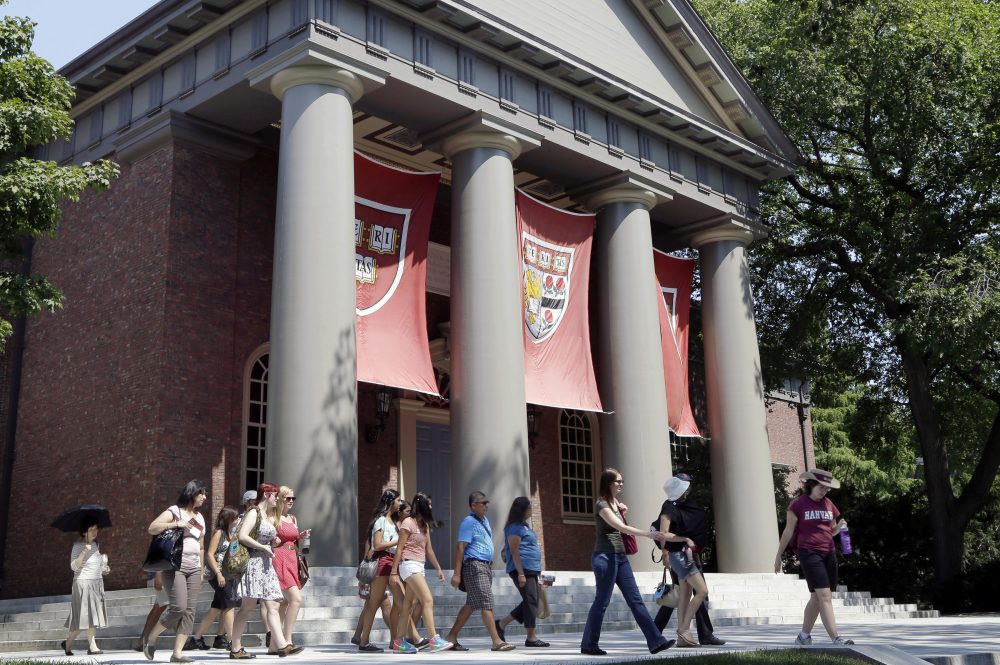 A tour group walks on Harvard's campus. (Elise Amendola/AP/File)