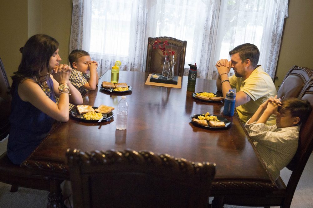 The civil religion of the 1960s was spoken largely in terms of Christianity, and more specifically Protestantism, writes Mark Edington. That is no longer a workable solution for a pluralistic society. Pictured: Praying before a meal in Ashville, Ohio., on Saturday, July 9, 2016. Strong Christian faith did not helped many voters find much inspiration in the presidential candidates in 2016. (John Minchillo/AP)