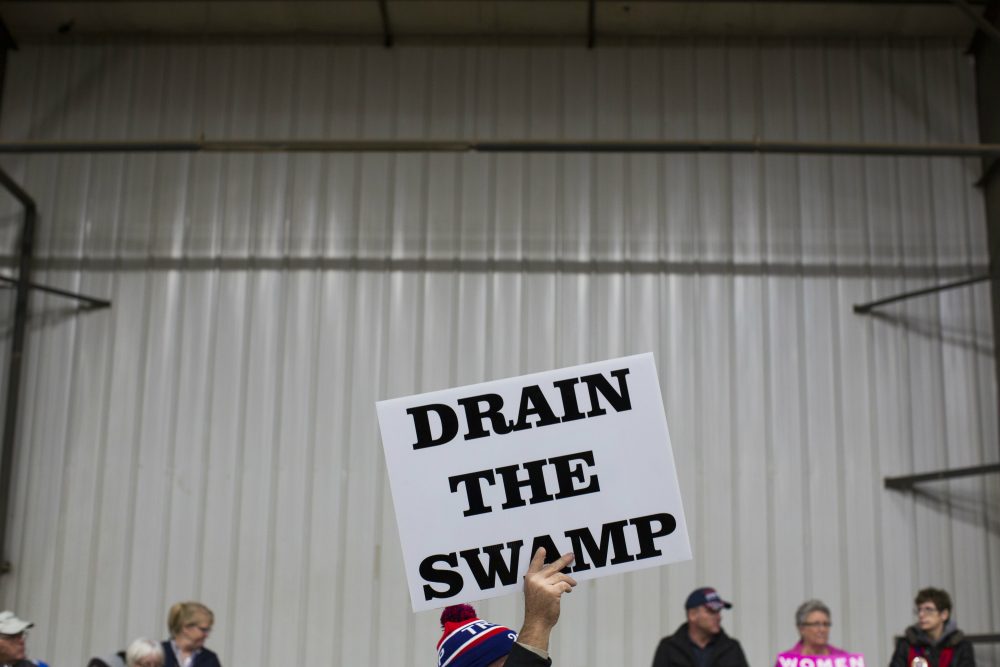 Jarrod is not afraid that Trump will install a kleptocratic oligarchy. writes Sebastian Stockman. He just assumes the president-elect will join the one that already exists. Pictured: Supporters of then-Republican presidential candidate Donald Trump hold signs during a campaign rally. (Evan Vucci/ AP)