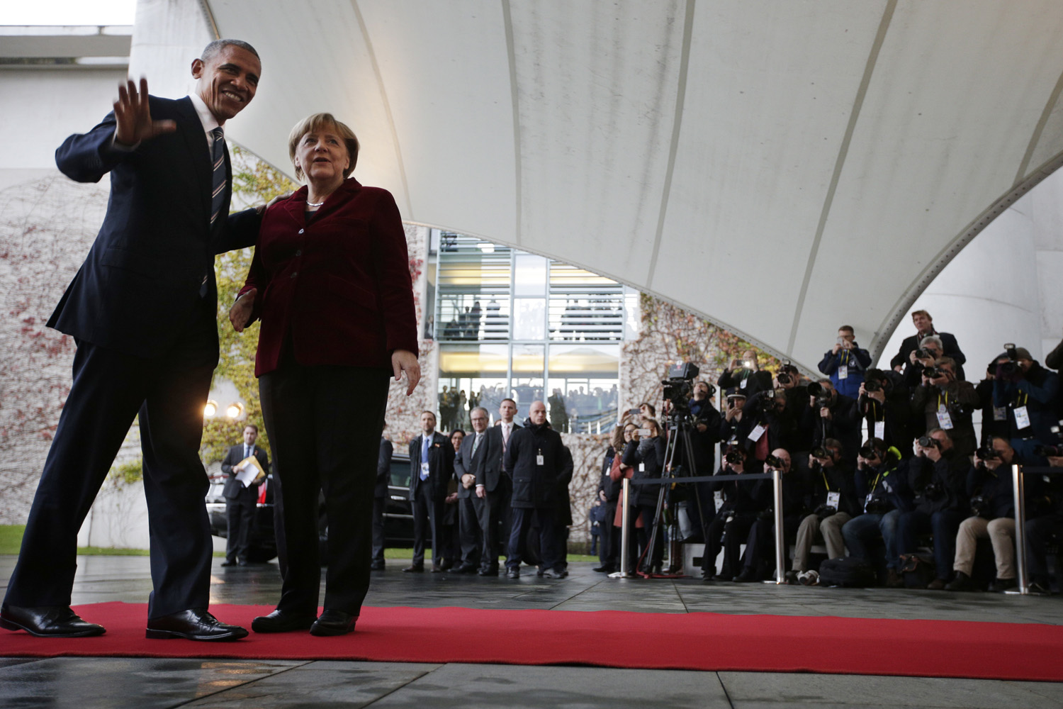 U.S. President Barack Obama, left, is welcomed by German Chancellor Angela Merkel prior to a meeting in the chancellery in Berlin, Germany, (Michael Sohn/AP)