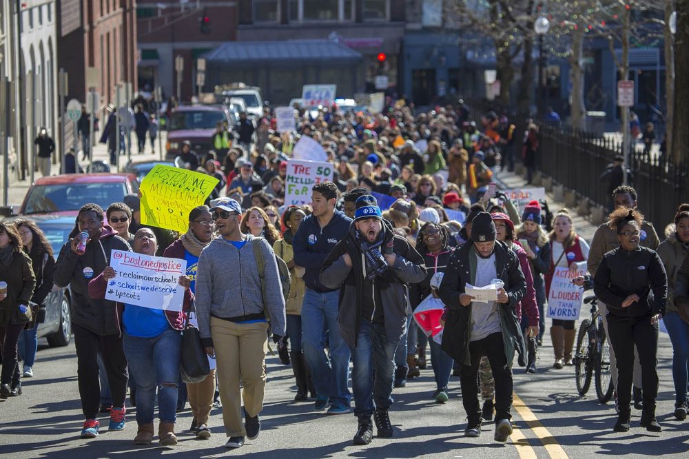 Activists march up Park Street from City Hall toward the State House to protest the proposed Boston Public Schools budget, which could fall short by $50 million. (Jesse Costa/WBUR)