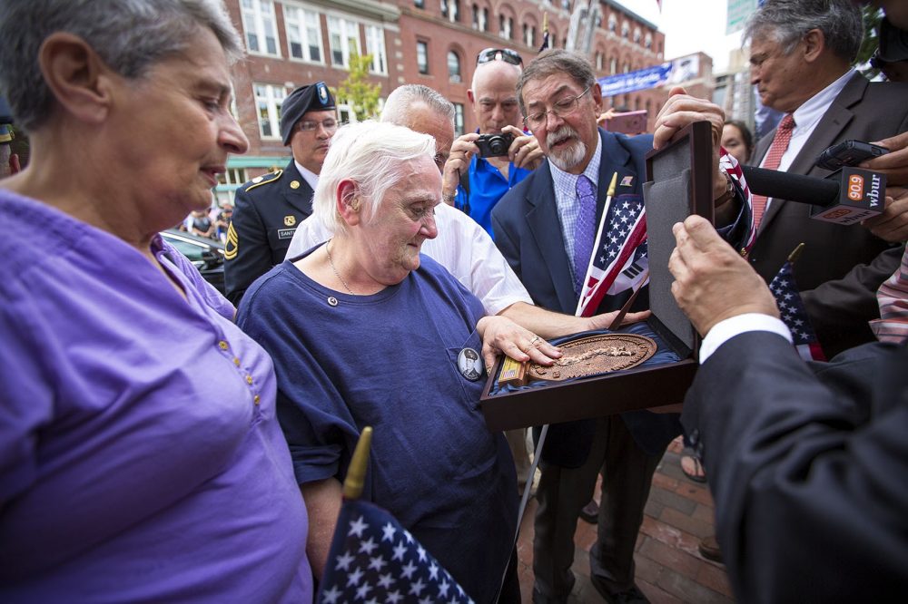 Ronald Sparks' sister, Irene, and her family were presented with a plaque honoring the memory and service of her older brother CPL Ronald M. Sparks in the Korean War. A ceremony commemorating the return of his remains took place in front of Cambridge City Hall. (Jesse Costa/WBUR)