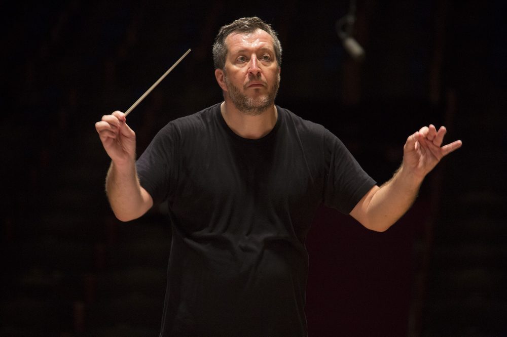 Thomas Adès, the Boston Symphony Orchestra's first artistic partner, conducts the BSO during rehearsal at Symphony Hall in November. (Jesse Costa/WBUR)