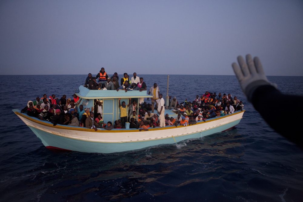 A boat coming from Libya is spotted and caught by the coast guards 35 miles away from Lampedusa, Italy in 2011. (Courtesy Patrick Zachmann/Magnum Photos)