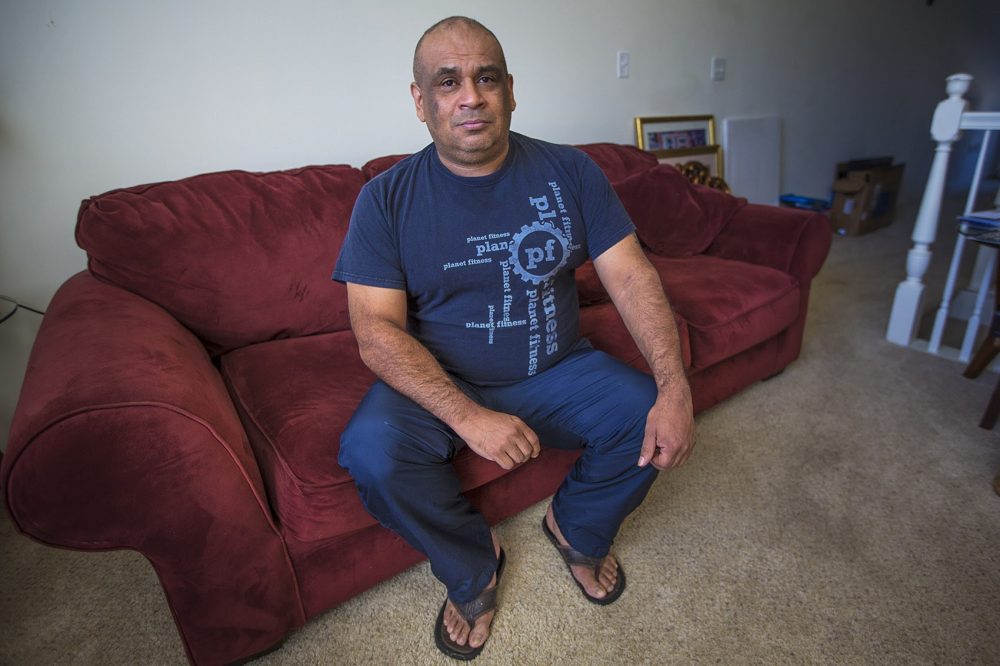 Jose Flores in his home (Jesse Costa/WBUR)