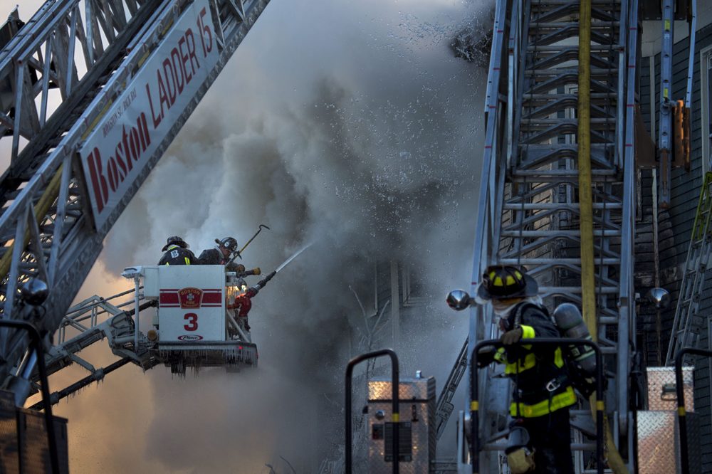 Boston Firefighters battle a 6-alarm fire on Bunker Hill Street in Charlestown. (Jesse Costa/WBUR)