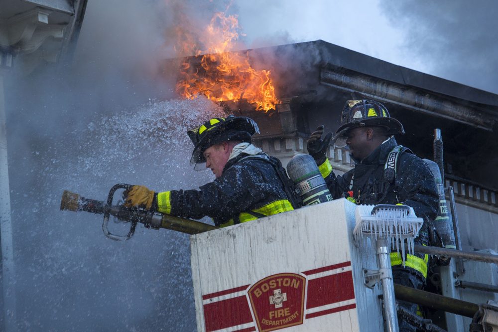 Boston Firefighters battle a 6-alarm fire on Bunker Hill Street in Charlestown. (Jesse Costa/WBUR)