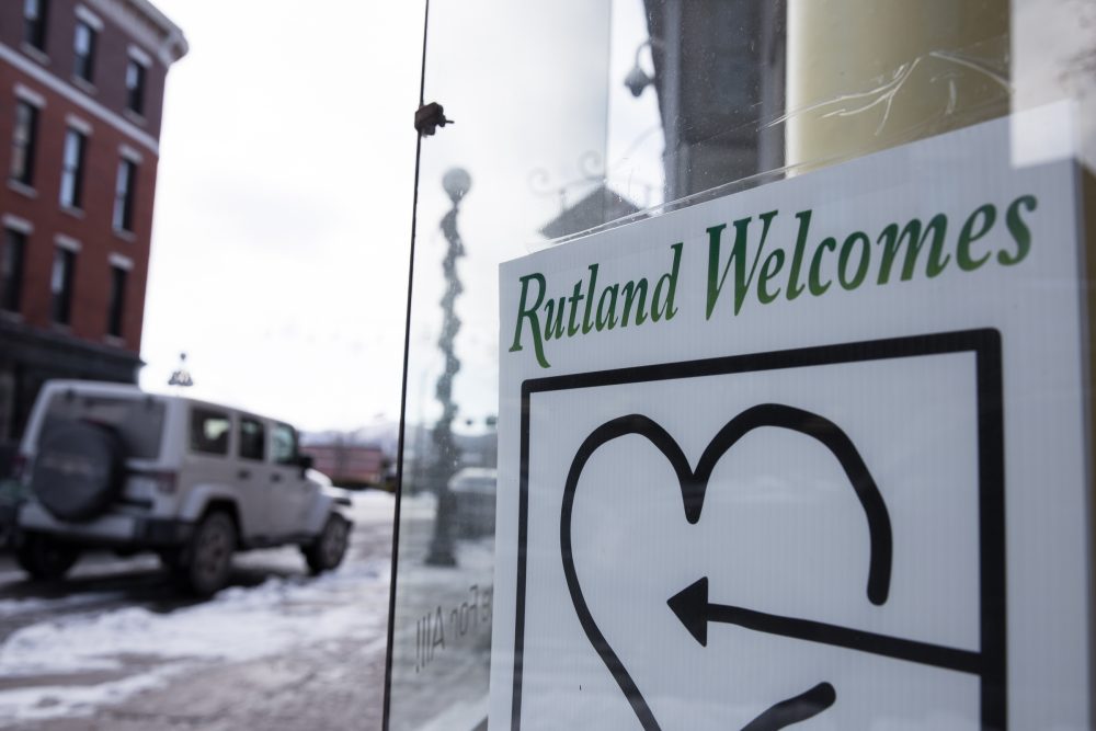 A refugee welcome group sign in a Rutland storefront. Rutland Welcomes was formed last spring just after the resettlement plan was announced. (Ryan Caron King/NENC)