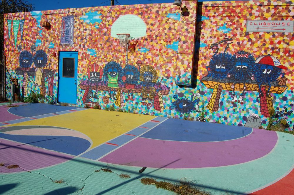 Murals by Caleb Neelon and Maria Molten at Somerville's Clubhouse. (Greg Cook/WBUR)