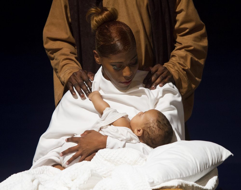 Mary and Joseph with baby Jesus during dress rehearsal. (Hadley Green for WBUR)