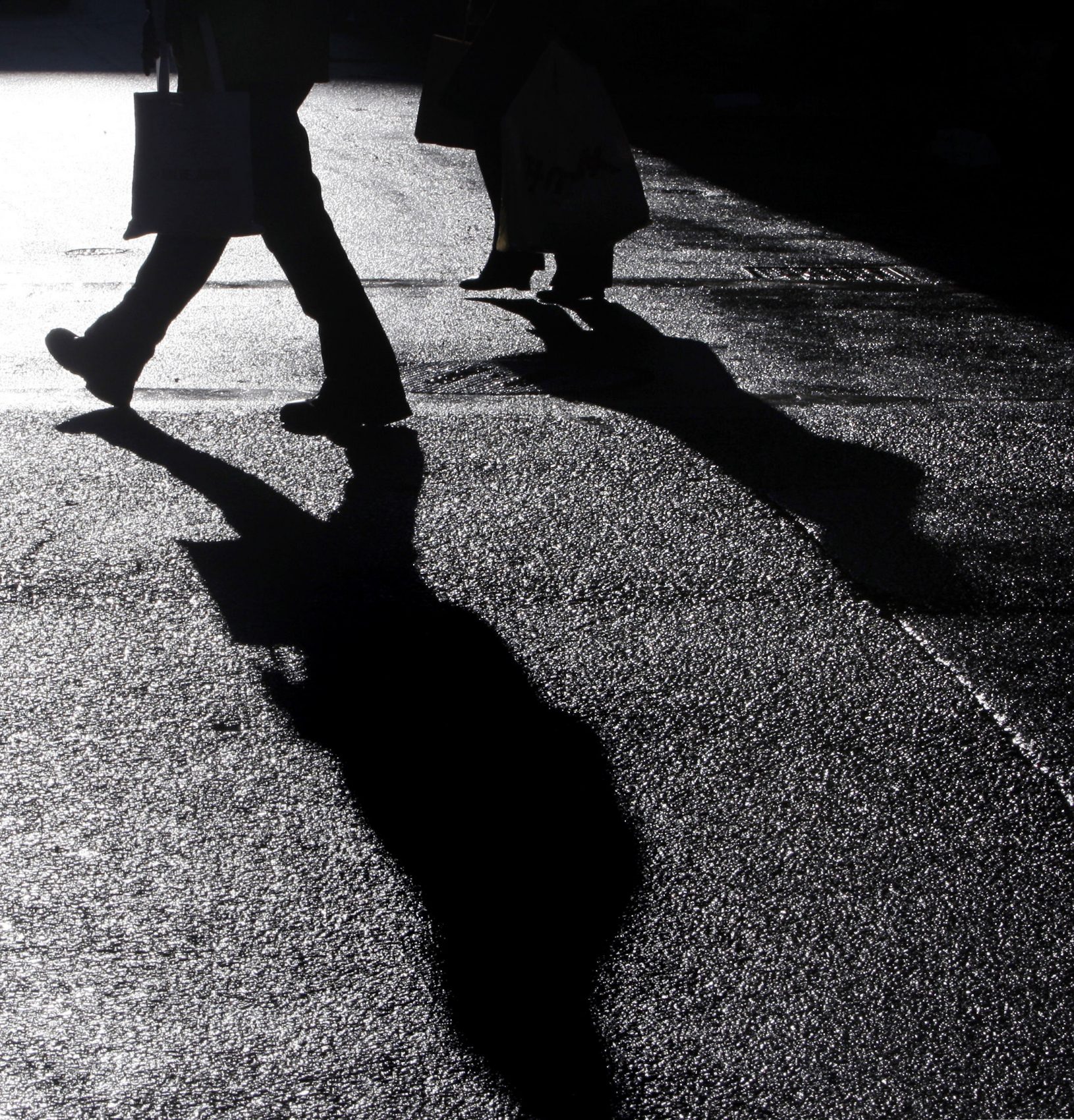 Holiday shoppers carry packages at Downtown Crossing in Boston on Dec. 22, 2009. (Charles Krupa/AP)