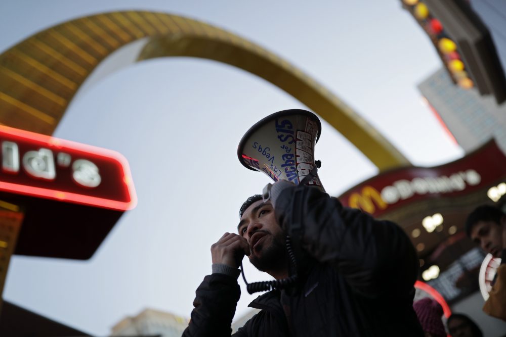 A minimum wage protester speaks near a McDonald's along the Las Vegas Strip on Nov. 29, 2016. (John Locher/AP)