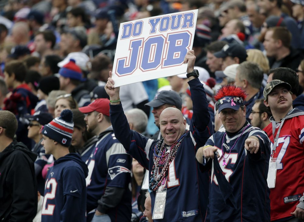 A Patriots fan holds a sign that says &quot;Do your job&quot; during a home game against the Jets on Oct. 25, 2015. (Steven Senne/AP)