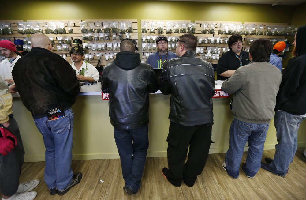The scene inside a Denver Medicine Man marijuana retail store on Jan. 1, 2014 -- the first day of retail sales. (Brennan Linsley/AP)