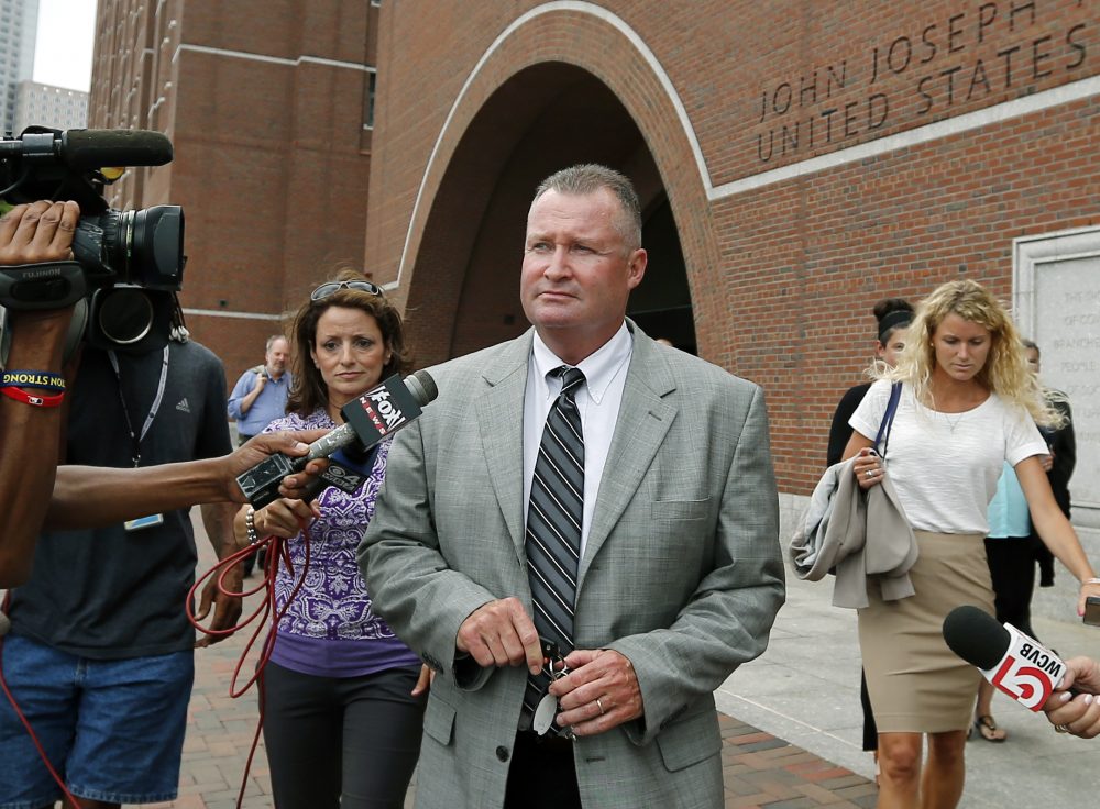 Former state probation Commissioner John O'Brien leaves Boston federal court on July 15, 2014. (Elise Amendola/AP)